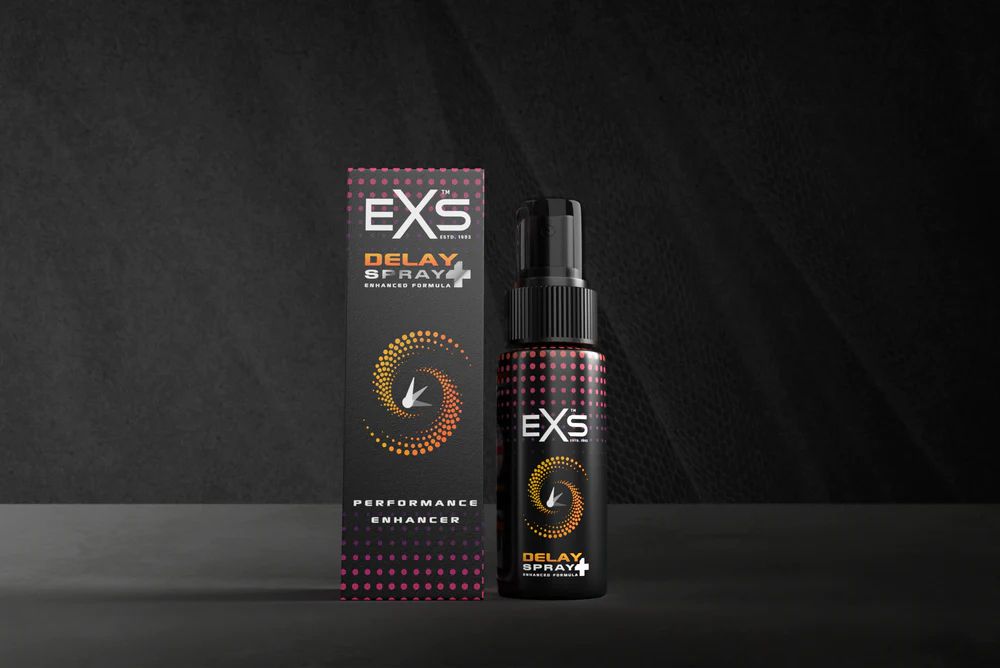 exs condoms delay spray on black back drop